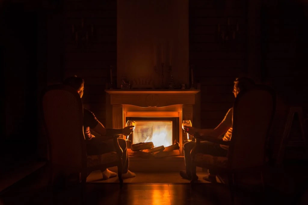 Couple in front of fireplace